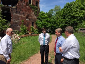 Senator Argall, second from right, Department of Community and Economic Development Secretary Davin, right, and Mike Shorr of DCED discuss demolition plans for Kaier’s Brewery in Mahanoy City with borough engineer Jim Rhoades Jr., left.