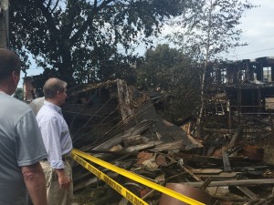 Senator Argall tours the scene of the fire on June 24 in downtown Shenandoah. The fire destroyed 11 vacant homes in the community. 