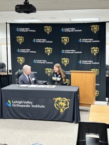 Senator Dave Argall with Lillian Brown, a sophomore and member of the swim team at Mahanoy Area High School, as he presents her with a Senate citation.