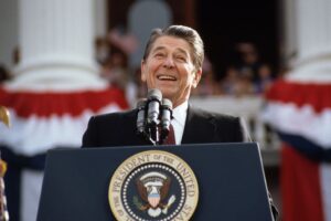 former President Ronald Reagan addressing a crowd.