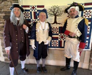 A picture of greeters at the America 250 Birthday Bash at Mountain Valley Golf Course.