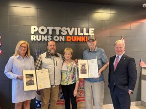 A picture of Sen. Argall and Sherri Hammer from Rep. Tim Twardzik’s office presenting a citation to Jason Bower and his family as they celebrate 50 years as Schuylkill County’s local Dunkin franchisee.
