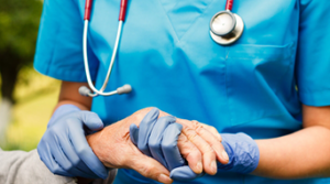 a nurse helping a patient.
