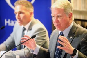 Senator Argall speaking on a microphone