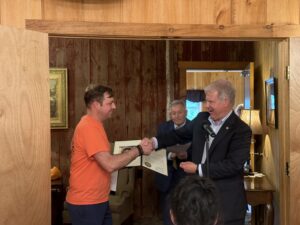 Sen. Argall congratulating Kenny Fetherolf, owner of Forget-Me-Not-Florist.