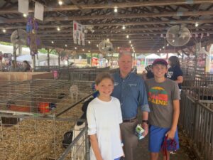 A picture of Senator Argall with Abby and Jacob Russo at the Schuylkill Fair.