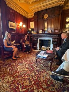 A picture of Sen. Argall speaking with Abri Kurtz and her family.