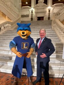A picture of Sen. Argall with Lycos the Warrior from Lycoming College.