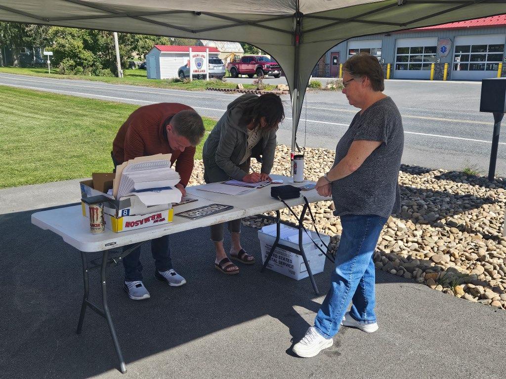 Sen. Argall’ staff and Rep. Joanne Stehr’s staff assisting constituents at a license plate evnet in Valley View.